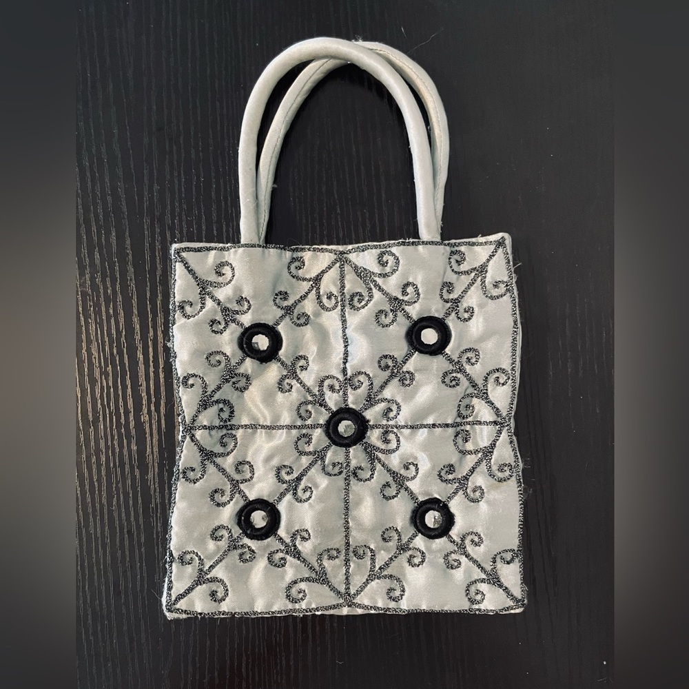 Silver satin hand bag